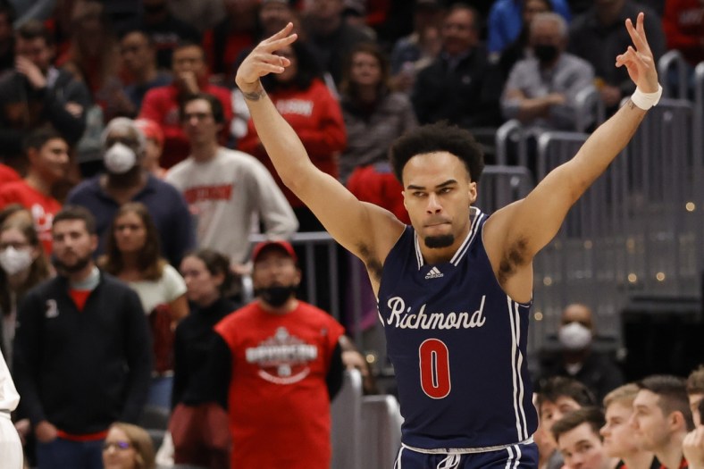 Mar 13, 2022; Washington, D.C., USA; Richmond Spiders guard Jacob Gilyard (0) reacts after making a three pint field goal against the Davidson Wildcats in the first half in the championship game of the Atlantic 10 conference at Capital One Arena. Mandatory Credit: Geoff Burke-USA TODAY Sports