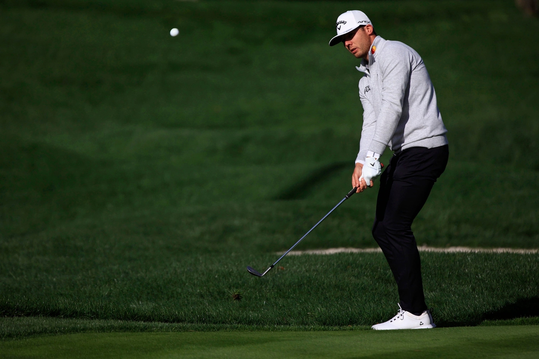 Sam Burns chips on 5 of the Players Stadium Course Sunday, March 13, 2022 at TPC Sawgrass in Ponte Vedra Beach. Sunday marked finishing second rounds and beginning third rounds of golf for The Players Championship.

Jki 031422 Playerssuncorey 37