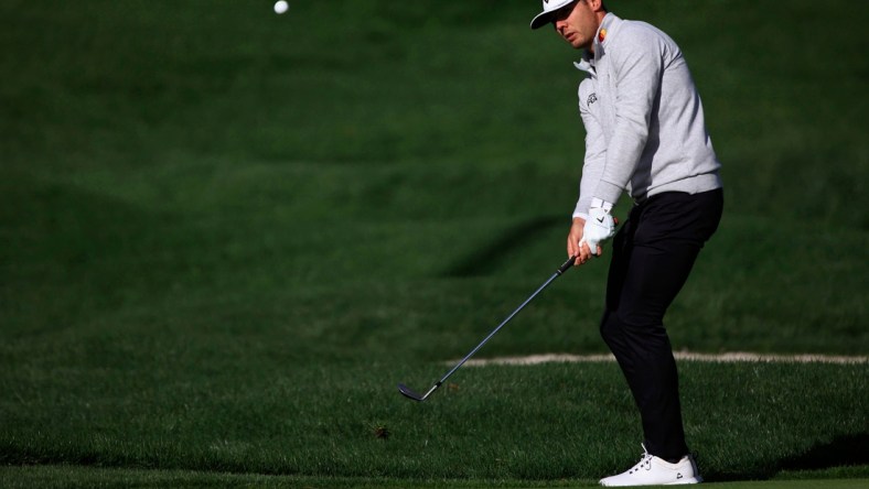 Sam Burns chips on 5 of the Players Stadium Course Sunday, March 13, 2022 at TPC Sawgrass in Ponte Vedra Beach. Sunday marked finishing second rounds and beginning third rounds of golf for The Players Championship.

Jki 031422 Playerssuncorey 37