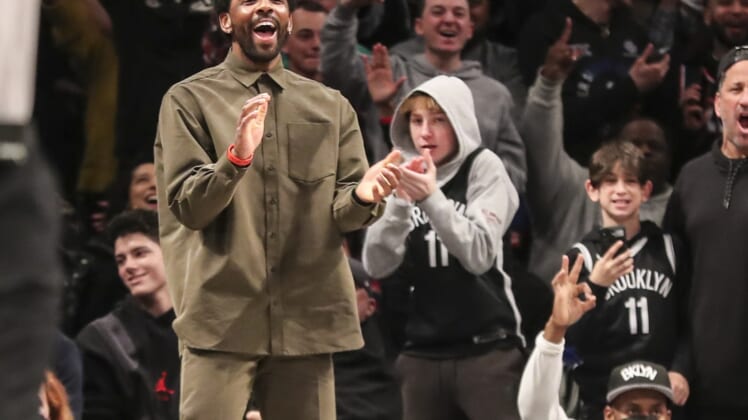 Mar 13, 2022; Brooklyn, New York, USA;  Brooklyn Nets guard Kyrie Irving (11) celebrates after the Nets take the lead against the New York Knicks in the fourth quarter at Barclays Center. Mandatory Credit: Wendell Cruz-USA TODAY Sports