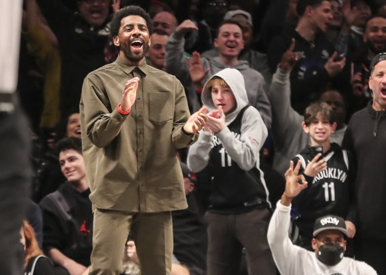 Mar 13, 2022; Brooklyn, New York, USA;  Brooklyn Nets guard Kyrie Irving (11) celebrates after the Nets take the lead against the New York Knicks in the fourth quarter at Barclays Center. Mandatory Credit: Wendell Cruz-USA TODAY Sports