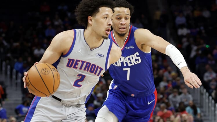 Mar 13, 2022; Detroit, Michigan, USA;  Detroit Pistons guard Cade Cunningham (2) defended by on LA Clippers guard Amir Coffey (7) in the first half at Little Caesars Arena. Mandatory Credit: Rick Osentoski-USA TODAY Sports