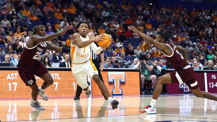 Mar 13, 2022; Tampa, FL, USA; Tennessee Volunteers guard Kennedy Chandler (1) drives to the basket against Texas A&M Aggies guard Tyrece Radford (23) and guard Quenton Jackson (3) during the second half at Amalie Arena. Mandatory Credit: Kim Klement-USA TODAY Sports