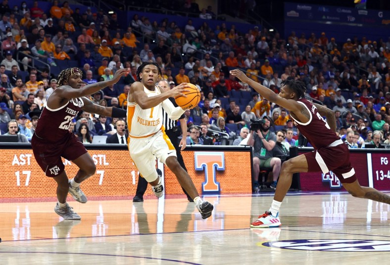 Mar 13, 2022; Tampa, FL, USA; Tennessee Volunteers guard Kennedy Chandler (1) drives to the basket against Texas A&M Aggies guard Tyrece Radford (23) and guard Quenton Jackson (3) during the second half at Amalie Arena. Mandatory Credit: Kim Klement-USA TODAY Sports