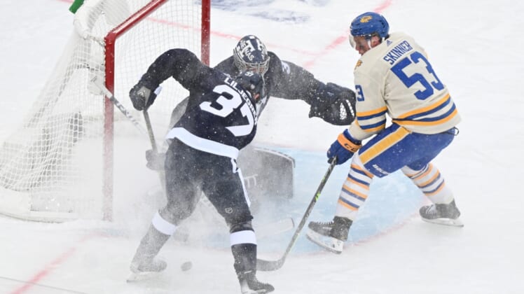 Mar 13, 2022; Hamilton, Ontario, CAN;  Toronto Maple Leafs goalie Petr Mrazek (35) makes a save on a shot from Buffalo Sabres forward Jeff Skinner (53) as defenseman Timothy Liljegren (37) looks to clear the rebound in the 2022 Heritage Classic ice hockey game at Tim Hortons Field. Mandatory Credit: Dan Hamilton-USA TODAY Sports