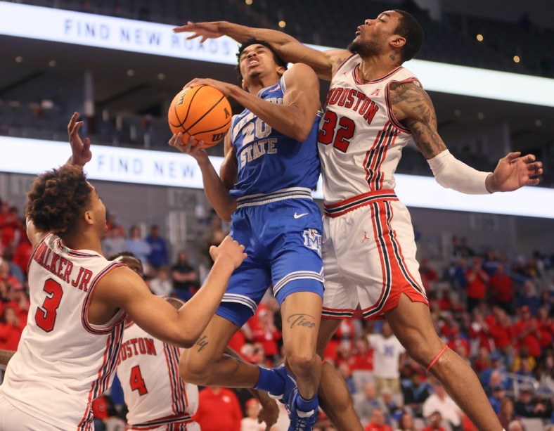 Memphis Tigers forward Josh Minott (20) is fouled by Houston Cougars forward Reggie Chaney (32) during their AAC Tournament Championship at Dickies Arena in Fort Worth, TX on Sunday, March 13, 2022.

Jrca9188