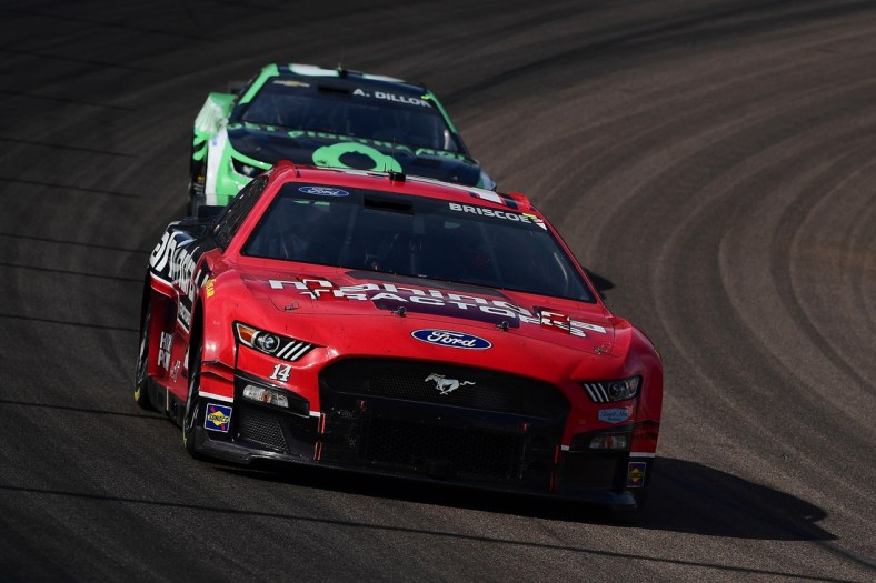 Mar 13, 2022; Avondale, Arizona, USA; NASCAR Cup Series driver Chase Briscoe (14) drives ahead of driver Austin Dillon (3) during the Ruoff Mortgage 500 at Phoenix Raceway. Mandatory Credit: Gary A. Vasquez-USA TODAY Sports