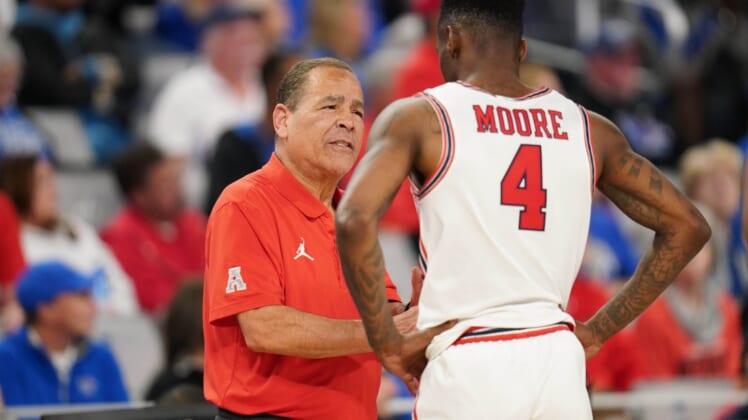 Mar 13, 2022; Fort Worth, TX, USA; Houston Cougars head coach Kelvin Sampson talks to guard Taze Moore (4) during a break in play during the second half at Dickies Arena. Mandatory Credit: Chris Jones-USA TODAY Sports