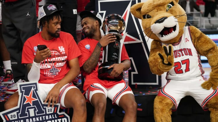 Mar 13, 2022; Fort Worth, TX, USA; The Houston Cougars celebrate punching their ticket to the NCAA Tournament after defeating the Memphis Tigers in the American Conference Tournament Championship at Dickies Arena.  Mandatory Credit: Chris Jones-USA TODAY Sports