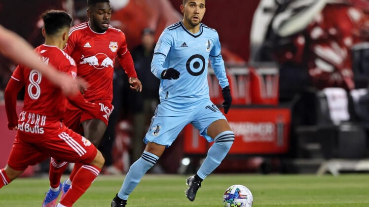 Mar 13, 2022; Harrison, New Jersey, USA;  Minnesota United midfielder Emanuel Reynoso (10) dribbles the ball against the New York Red Bulls during the first half at Red Bull Arena. Mandatory Credit: Vincent Carchietta-USA TODAY Sports