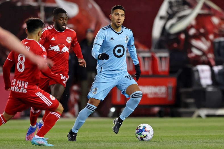 Mar 13, 2022; Harrison, New Jersey, USA;  Minnesota United midfielder Emanuel Reynoso (10) dribbles the ball against the New York Red Bulls during the first half at Red Bull Arena. Mandatory Credit: Vincent Carchietta-USA TODAY Sports