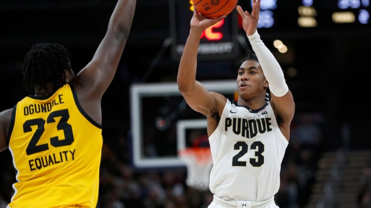 Iowa Hawkeyes forward Josh Ogundele (23) jumps up as Purdue Boilermakers guard Jaden Ivey (23) shoots during the second half of the Big Ten championship title game Sunday, March 13, 2022, at Gainbridge Fieldhouse in Indianapolis. Iowa won, 75-66.Iowa Hawkeyes Versus Purdue Boilermakers In Big Ten Men S Championship Title Game On Sunday March 13 2022 At Gainbridge Fieldhouse In Indianapolis