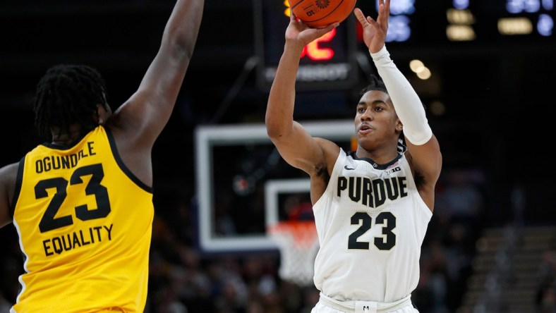 Iowa Hawkeyes forward Josh Ogundele (23) jumps up as Purdue Boilermakers guard Jaden Ivey (23) shoots during the second half of the Big Ten championship title game Sunday, March 13, 2022, at Gainbridge Fieldhouse in Indianapolis. Iowa won, 75-66.

Iowa Hawkeyes Versus Purdue Boilermakers In Big Ten Men S Championship Title Game On Sunday March 13 2022 At Gainbridge Fieldhouse In Indianapolis