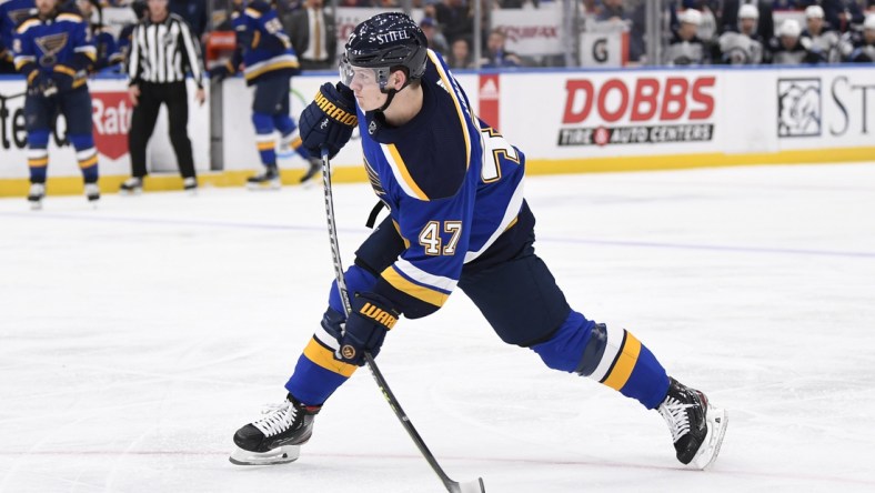 Mar 13, 2022; St. Louis, Missouri, USA; St. Louis Blues defenseman Torey Krug (47) takes a shot against the Winnipeg Jets during the second period at Enterprise Center. Mandatory Credit: Jeff Le-USA TODAY Sports