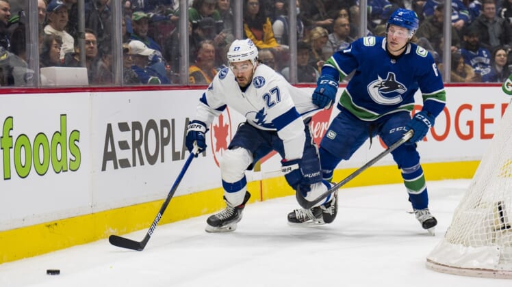 Mar 13, 2022; Vancouver, British Columbia, CAN; Vancouver Canucks forward Brock Boeser (6) holds up Tampa Bay Lightning defenseman Ryan McDonagh (27) in the first period at Rogers Arena. Mandatory Credit: Bob Frid-USA TODAY Sports