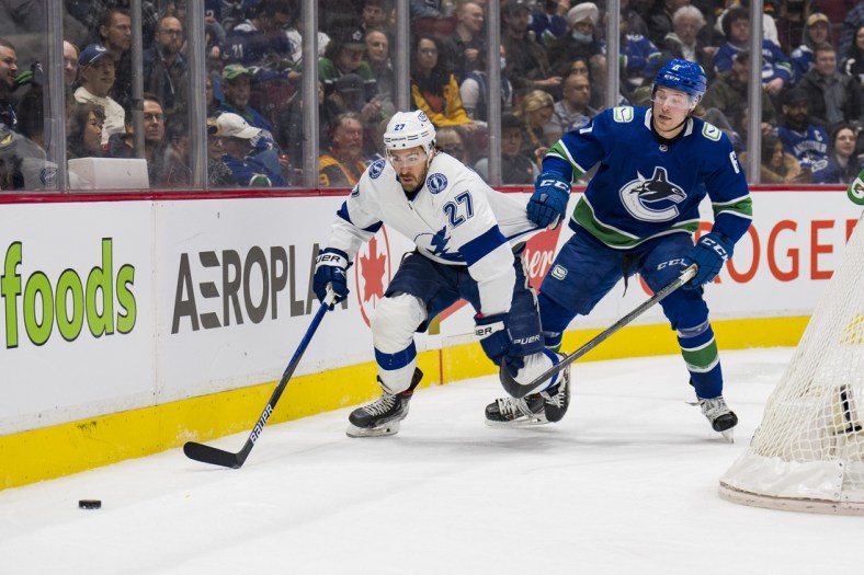 Mar 13, 2022; Vancouver, British Columbia, CAN; Vancouver Canucks forward Brock Boeser (6) holds up Tampa Bay Lightning defenseman Ryan McDonagh (27) in the first period at Rogers Arena. Mandatory Credit: Bob Frid-USA TODAY Sports