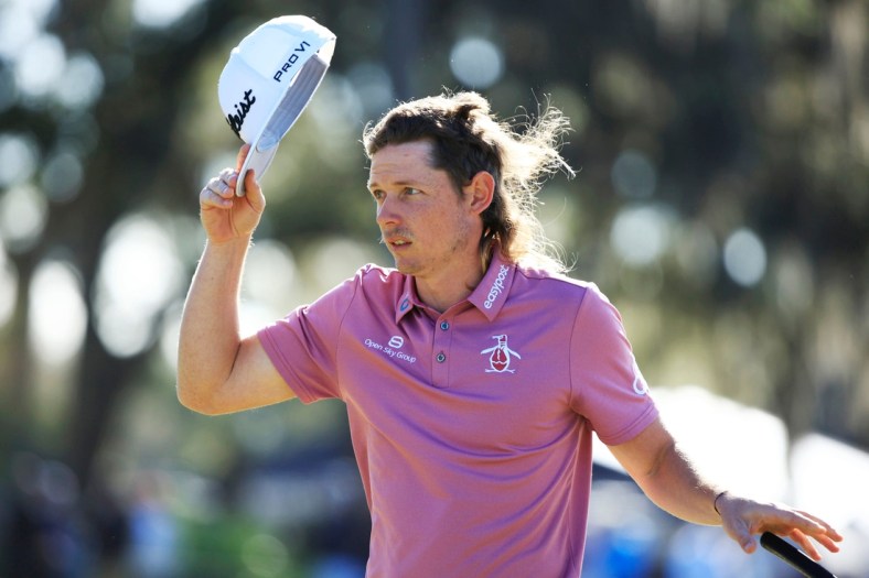 Cameron Smith acknowledges the crowd after completing his third round on 18 of the Players Stadium Course Monday, March 14, 2022 at TPC Sawgrass in Ponte Vedra Beach. Monday marked finishing third rounds and final rounds of golf for The Players Championship.

Jki 031522 Playersmoncorey 28