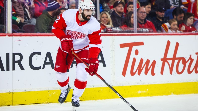 Mar 12, 2022; Calgary, Alberta, CAN; Detroit Red Wings defenseman Nick Leddy (2) skates with the puck against the Calgary Flames during the second period at Scotiabank Saddledome. Mandatory Credit: Sergei Belski-USA TODAY Sports