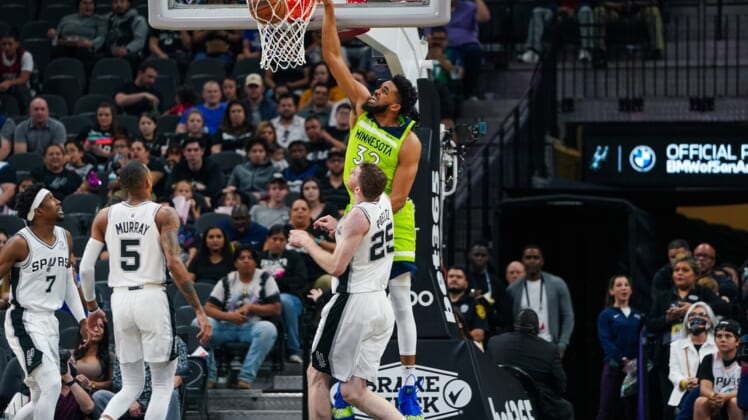 Mar 14, 2022; San Antonio, Texas, USA; Minnesota Timberwolves center Karl-Anthony Towns (32) dunks in the first half against the San Antonio Spurs at the AT&T Center. Mandatory Credit: Daniel Dunn-USA TODAY Sports