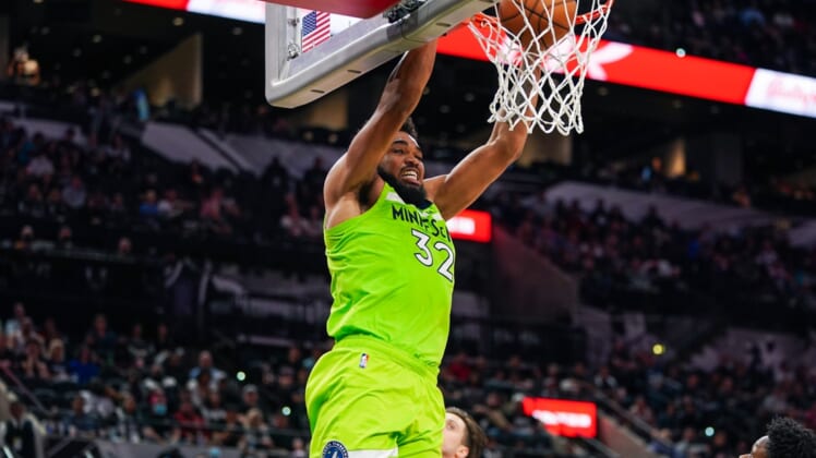 Mar 14, 2022; San Antonio, Texas, USA; Minnesota Timberwolves center Karl-Anthony Towns (32) dunks in the second half against the San Antonio Spurs at the AT&T Center. Mandatory Credit: Daniel Dunn-USA TODAY Sports