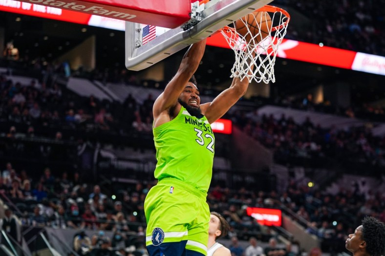 Mar 14, 2022; San Antonio, Texas, USA; Minnesota Timberwolves center Karl-Anthony Towns (32) dunks in the second half against the San Antonio Spurs at the AT&T Center. Mandatory Credit: Daniel Dunn-USA TODAY Sports