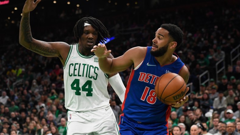 Mar 11, 2022; Boston, Massachusetts, USA;  Detroit Pistons guard Cory Joseph (18) looks to pass the ball while Boston Celtics center Robert Williams III (44) defends during the first half at TD Garden. Mandatory Credit: Bob DeChiara-USA TODAY Sports