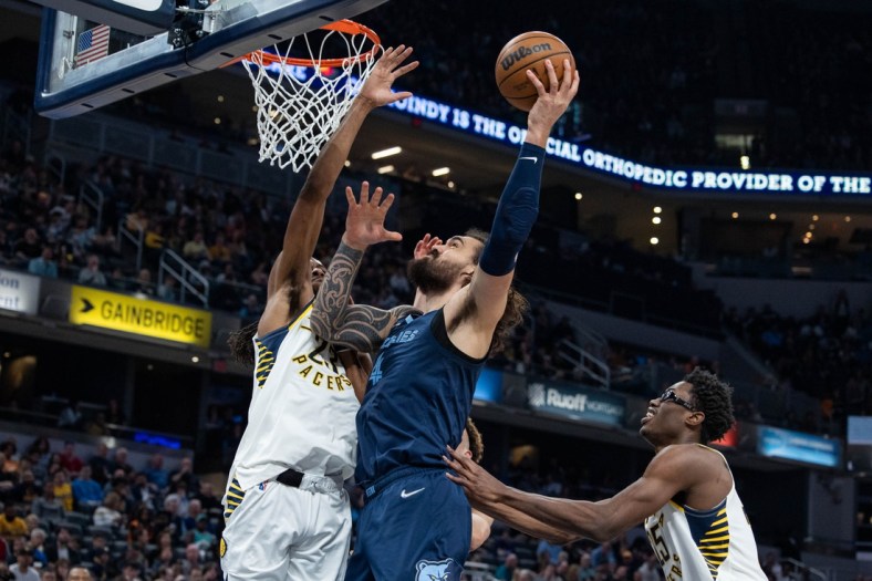 Mar 15, 2022; Indianapolis, Indiana, USA; Memphis Grizzlies center Steven Adams (4) shoots the ball while Indiana Pacers forward Isaiah Jackson (23) defends in the first half at Gainbridge Fieldhouse. Mandatory Credit: Trevor Ruszkowski-USA TODAY Sports