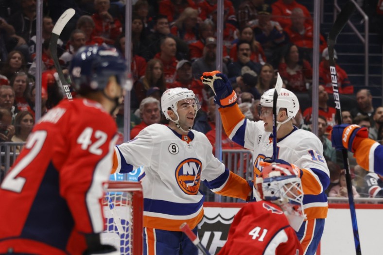 Mar 15, 2022; Washington, District of Columbia, USA; New York Islanders right wing Kyle Palmieri (21) celebrates with Islanders right wing Josh Bailey (12) after scoring a goal on Washington Capitals goaltender Vitek Vanecek (41) in the second period at Capital One Arena. Mandatory Credit: Geoff Burke-USA TODAY Sports