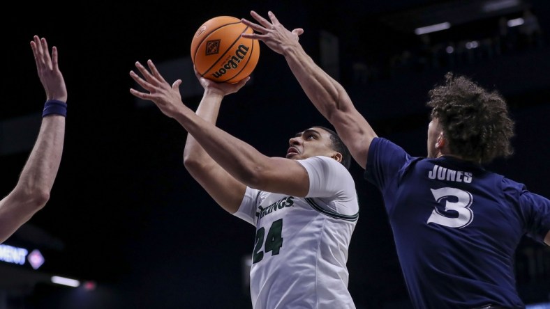 Mar 15, 2022; Cincinnati, Ohio, USA; Cleveland State Vikings guard Torrey Patton (24) shoots against Xavier Musketeers guard Colby Jones (3) in the first half at Cintas Center. Mandatory Credit: Katie Stratman-USA TODAY Sports