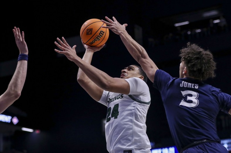 Mar 15, 2022; Cincinnati, Ohio, USA; Cleveland State Vikings guard Torrey Patton (24) shoots against Xavier Musketeers guard Colby Jones (3) in the first half at Cintas Center. Mandatory Credit: Katie Stratman-USA TODAY Sports