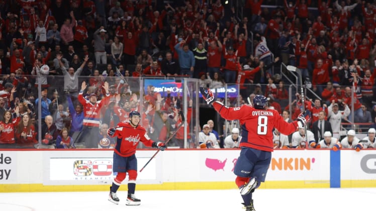 Mar 15, 2022; Washington, District of Columbia, USA; Washington Capitals left wing Alex Ovechkin (8) celebrates after scoring a goal against the New York Islanders in the third period at Capital One Arena. It was Ovechkin's 767th NHL goal, moving him into third place in all-time goals. Mandatory Credit: Geoff Burke-USA TODAY Sports