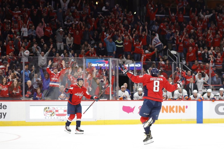 Mar 15, 2022; Washington, District of Columbia, USA; Washington Capitals left wing Alex Ovechkin (8) celebrates after scoring a goal against the New York Islanders in the third period at Capital One Arena. It was Ovechkin's 767th NHL goal, moving him into third place in all-time goals. Mandatory Credit: Geoff Burke-USA TODAY Sports