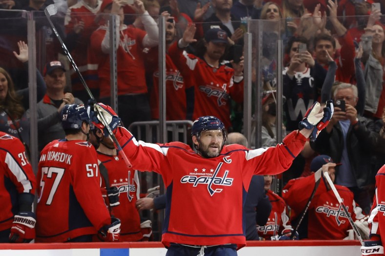 Mar 15, 2022; Washington, District of Columbia, USA; Washington Capitals left wing Alex Ovechkin (8) salutes the fans after scoring a goal against the New York Islanders in the third period at Capital One Arena. It was Ovechkin's 767th NHL goal, moving him into third place in all-time goals. Mandatory Credit: Geoff Burke-USA TODAY Sports