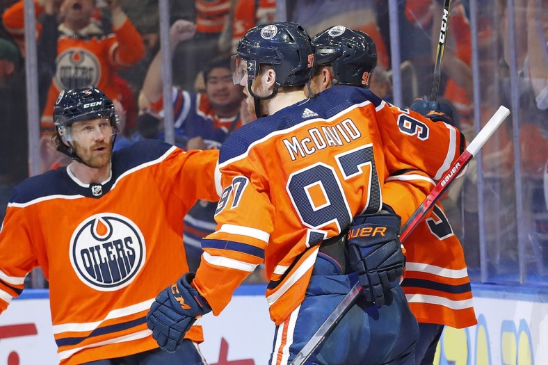 Mar 15, 2022; Edmonton, Alberta, CAN; Edmonton Oilers players celebrate a goal by forward Evander Kane (91) during the third period against the Detroit Red Wings at Rogers Place. Mandatory Credit: Perry Nelson-USA TODAY Sports
