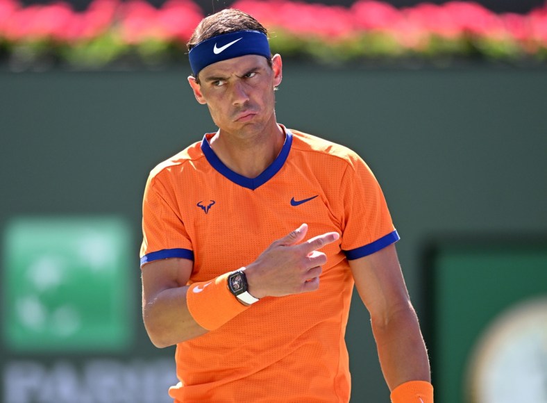 Mar 16, 2022; Indian Wells, CA, USA;  Rafael Nadal (ESP) questions a line call during his fourth round match against Reilly Opelka (USA) in the fourth round at the BNP Paribas Open at the Indian Wells Tennis Garden. Mandatory Credit: Jayne Kamin-Oncea-USA TODAY Sports