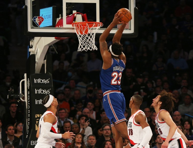 Mar 16, 2022; New York, New York, USA; New York Knicks center Mitchell Robinson (23) goes up for a dunk against the Portland Trail Blazers during the first half at Madison Square Garden. Mandatory Credit: Andy Marlin-USA TODAY Sports