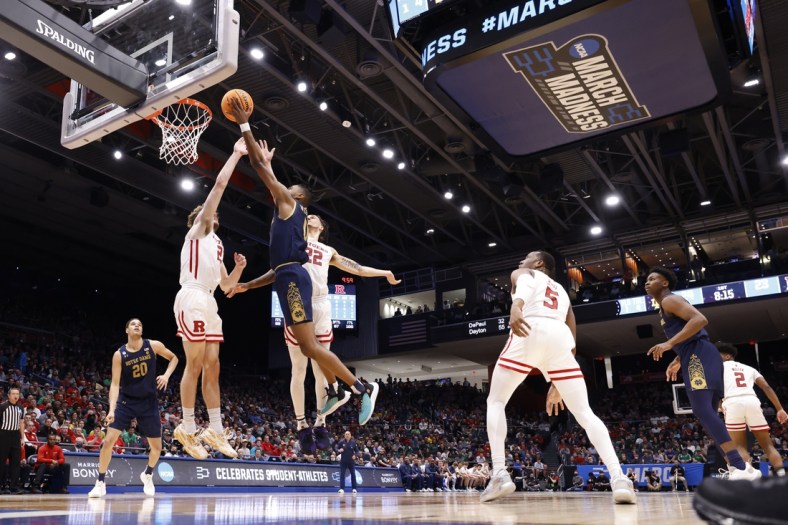 Mar 16, 2022; Dayton, Ohio, USA; Notre Dame Fighting Irish guard Blake Wesley (0) shoots the ball defended by Rutgers Scarlet Knights guard Jalen Miller (2) in the first half at University of Dayton Arena. Mandatory Credit: Rick Osentoski-USA TODAY Sports