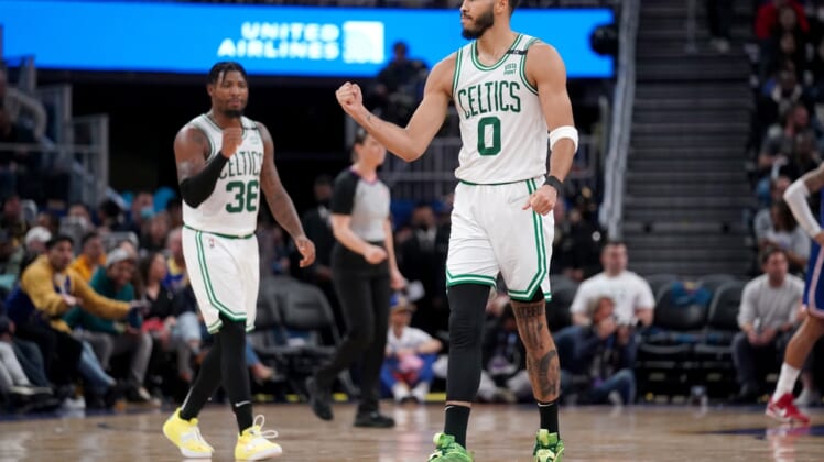 Mar 16, 2022; San Francisco, California, USA; Boston Celtics forward Jayson Tatum (0) and guard Marcus Smart (36) pump their fist after the Celtics made a basket against the Golden State Warriors in the second quarter at the Chase Center. Mandatory Credit: Cary Edmondson-USA TODAY Sports