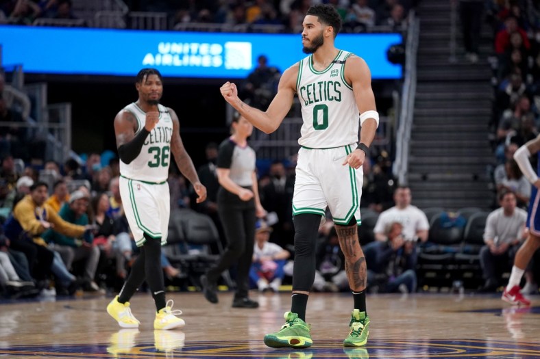 Mar 16, 2022; San Francisco, California, USA; Boston Celtics forward Jayson Tatum (0) and guard Marcus Smart (36) pump their fist after the Celtics made a basket against the Golden State Warriors in the second quarter at the Chase Center. Mandatory Credit: Cary Edmondson-USA TODAY Sports