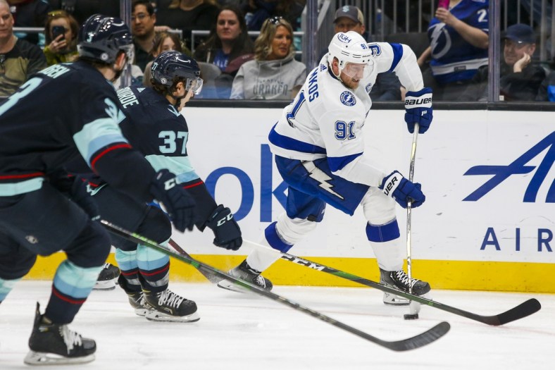 Mar 16, 2022; Seattle, Washington, USA; Tampa Bay Lightning center Steven Stamkos (91) skates with the puck against the Seattle Kraken during the third period at Climate Pledge Arena. Mandatory Credit: Joe Nicholson-USA TODAY Sports