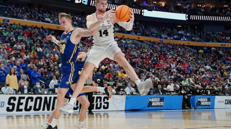 Mar 17, 2022; Buffalo, NY, USA; Providence Friars forward Noah Horchler (14) grabs a rebound against South Dakota State Jackrabbits guard Charlie Easley (30) in the second half during the first round of the 2022 NCAA Tournament at KeyBank Center. Mandatory Credit: Gregory Fisher-USA TODAY Sports