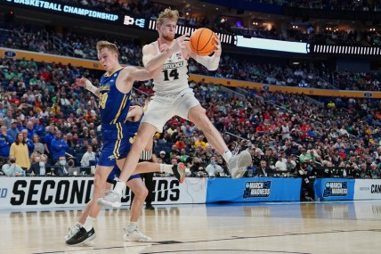 Mar 17, 2022; Buffalo, NY, USA; Providence Friars forward Noah Horchler (14) grabs a rebound against South Dakota State Jackrabbits guard Charlie Easley (30) in the second half during the first round of the 2022 NCAA Tournament at KeyBank Center. Mandatory Credit: Gregory Fisher-USA TODAY Sports