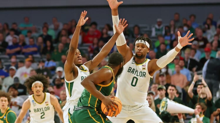 Mar 17, 2022; Fort Worth, TX, USA; Baylor Bears guard Dale Bonner (left) and forward Flo Thamba (right) defend Norfolk State Spartans guard Joe Bryant Jr. (4) during the first half during the first round of the 2022 NCAA Tournament at Dickies Arena. Mandatory Credit: Kevin Jairaj-USA TODAY Sports