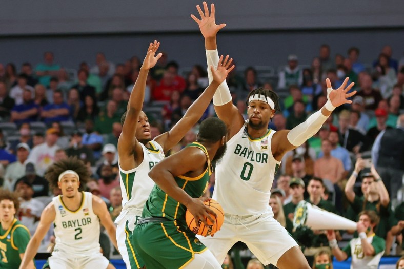Mar 17, 2022; Fort Worth, TX, USA; Baylor Bears guard Dale Bonner (left) and forward Flo Thamba (right) defend Norfolk State Spartans guard Joe Bryant Jr. (4) during the first half during the first round of the 2022 NCAA Tournament at Dickies Arena. Mandatory Credit: Kevin Jairaj-USA TODAY Sports