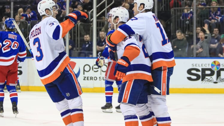 Mar 17, 2022; New York, New York, USA; New York Islanders right wing Kyle Palmieri (21) celebrates his go ahead goal against the New York Rangers during the third period at Madison Square Garden. Mandatory Credit: Danny Wild-USA TODAY Sports