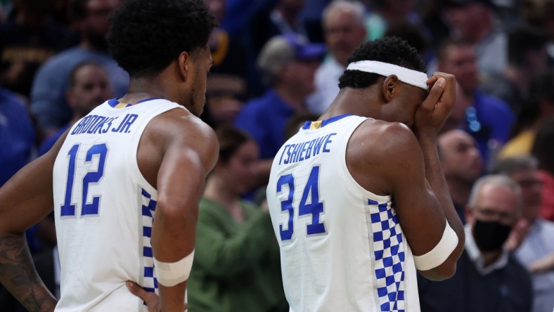 Mar 17, 2022; Indianapolis, IN, USA; Kentucky Wildcats forward Oscar Tshiebwe (34) reacts after losing to the Saint Peter's Peacocks during the first round of the 2022 NCAA Tournament at Gainbridge Fieldhouse. Mandatory Credit: Trevor Ruszkowski-USA TODAY Sports