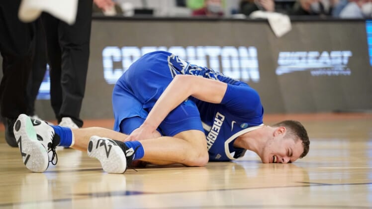 Mar 17, 2022; Fort Worth, TX, USA; Creighton Bluejays center Ryan Kalkbrenner (11) appears to injure his knee during the second half against the San Diego State Aztecs in the first round of the 2022 NCAA Tournament at Dickies Arena. Mandatory Credit: Chris Jones-USA TODAY Sports