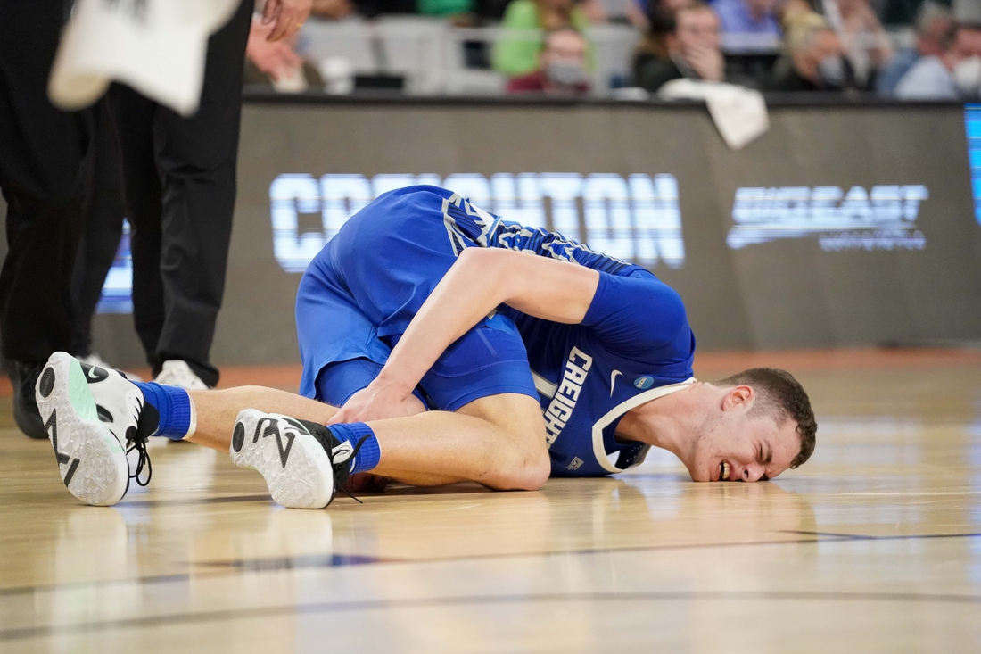 Mar 17, 2022; Fort Worth, TX, USA; Creighton Bluejays center Ryan Kalkbrenner (11) appears to injure his knee during the second half against the San Diego State Aztecs in the first round of the 2022 NCAA Tournament at Dickies Arena. Mandatory Credit: Chris Jones-USA TODAY Sports