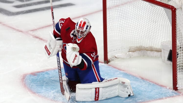 Mar 17, 2022; Montreal, Quebec, CAN; Montreal Canadiens goaltender Jake Allen (34) makes a save against the Dallas Stars during the third period at Bell Centre. Mandatory Credit: Jean-Yves Ahern-USA TODAY Sports