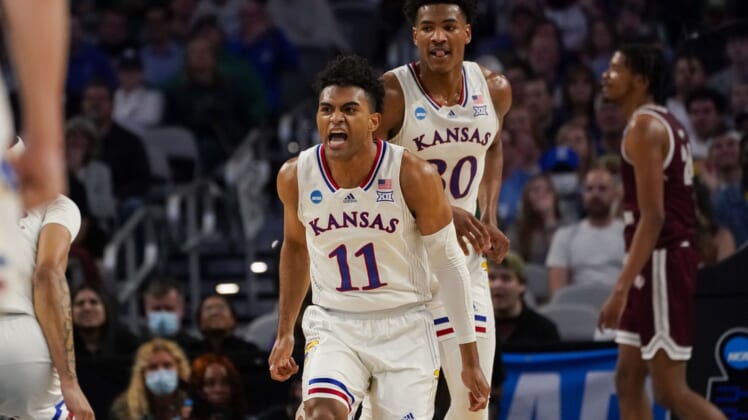 Mar 17, 2022; Fort Worth, TX, USA; Kansas Jayhawks guard Remy Martin (11) and guard Ochai Agbaji (30) celebrates during the first half against the Texas Southern Tigers in the first round of the 2022 NCAA Tournament at Dickies Arena. Mandatory Credit: Chris Jones-USA TODAY Sports